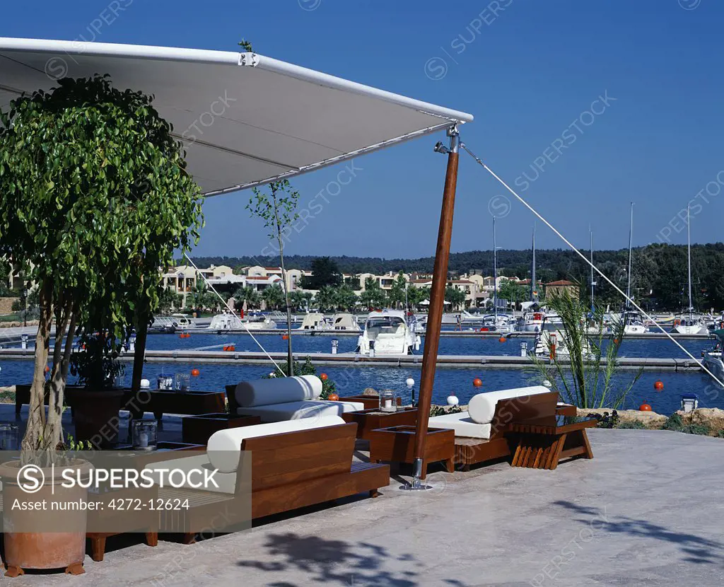 Outside sitting area and bar of the Asterias Suites overlooks the marina