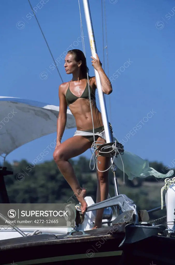 Girl sun-bathing on yacht
