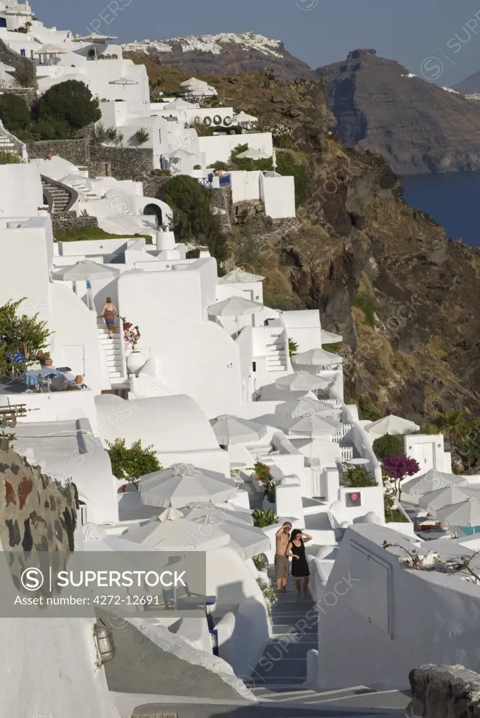 Greece, Santorini, Oia. Along the cliff of Oia, houses have been delved into the porous volcanic rock.