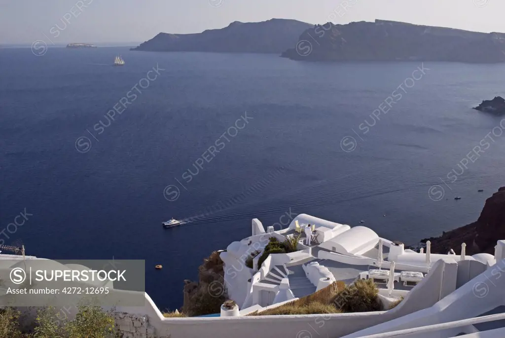 Greece, Santorini, Oia. Along the cliff of Oia, houses have been delved into the porous volcanic rock.