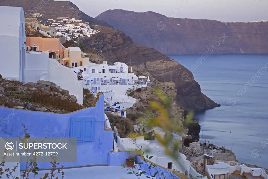 Greece, Santorini, Oia. Along the cliff of Oia, houses have been built into the porous volcanic rock.