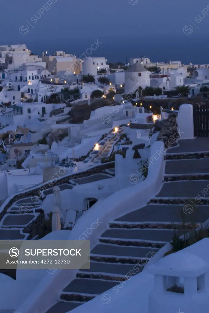 Greece, Santorini, Oia. Along the cliff of Oia, houses have been delved into the porous volcanic rock