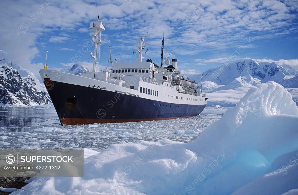 Antarctica, Andvord Bay, Neko Harbour. Tourist expedition ship 'Endeavor' anchored amongst ice
