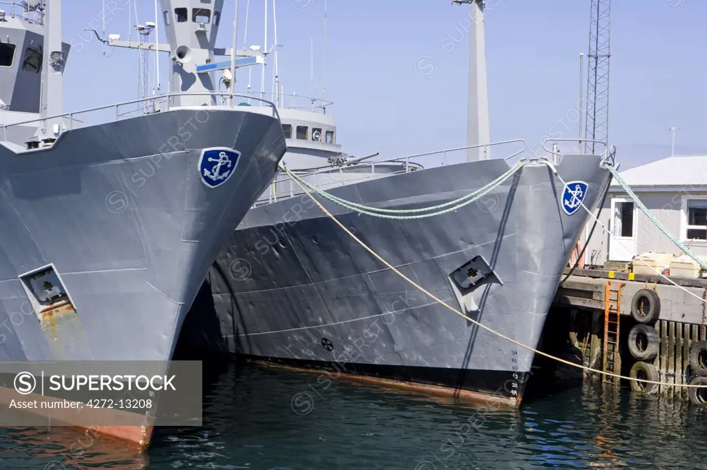 Iceland, Reykjavik. In the port area of Reykjavik, the country's capital , Icelandic navy patrol vessels are tied up alongside the jetty.