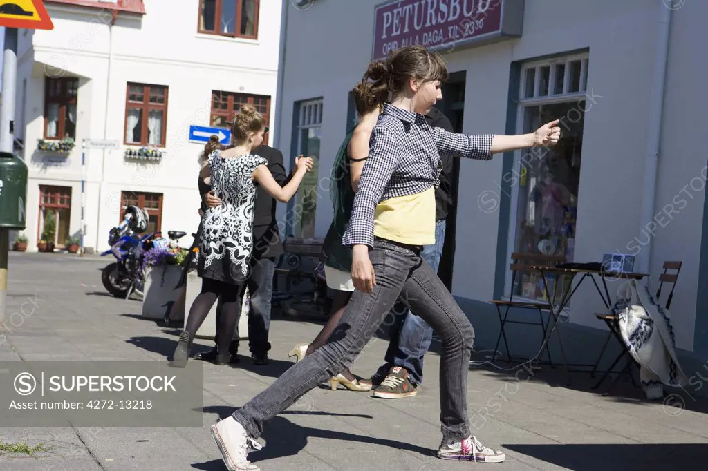 Iceland, Reykjavik. During the warm summer months, the locals take outdoor latin dancing lessons.