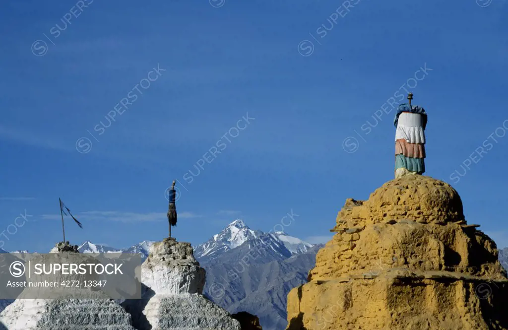 Stupas with Stok Kangri peak behind