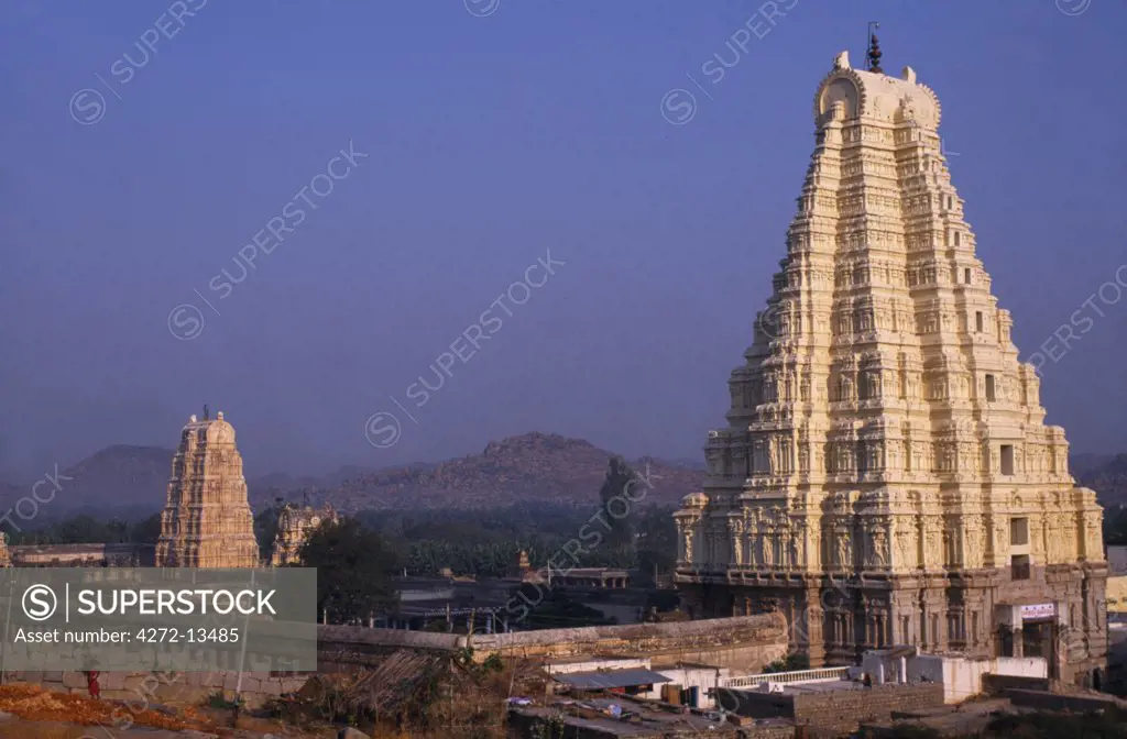 A soaring gateway or gopura, marks the entrance of the Virupaksha, Hampi's largest and still functioning temple