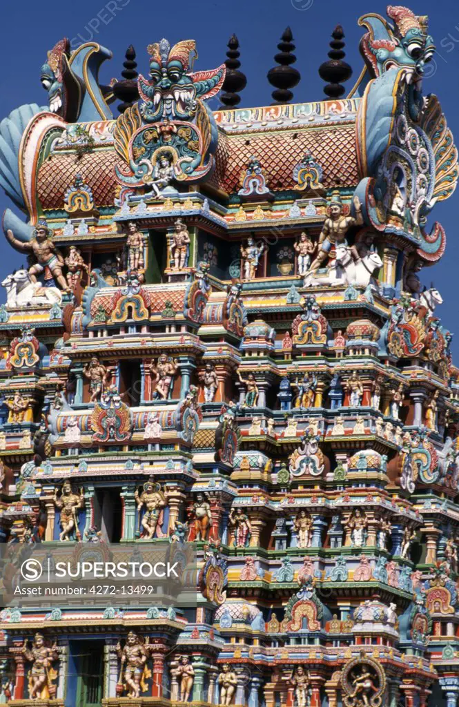 Exuberant and colourful sculpture decorates the main gopura or gateway of the enormous Shri Meenakshi-Sundareshwarar temple