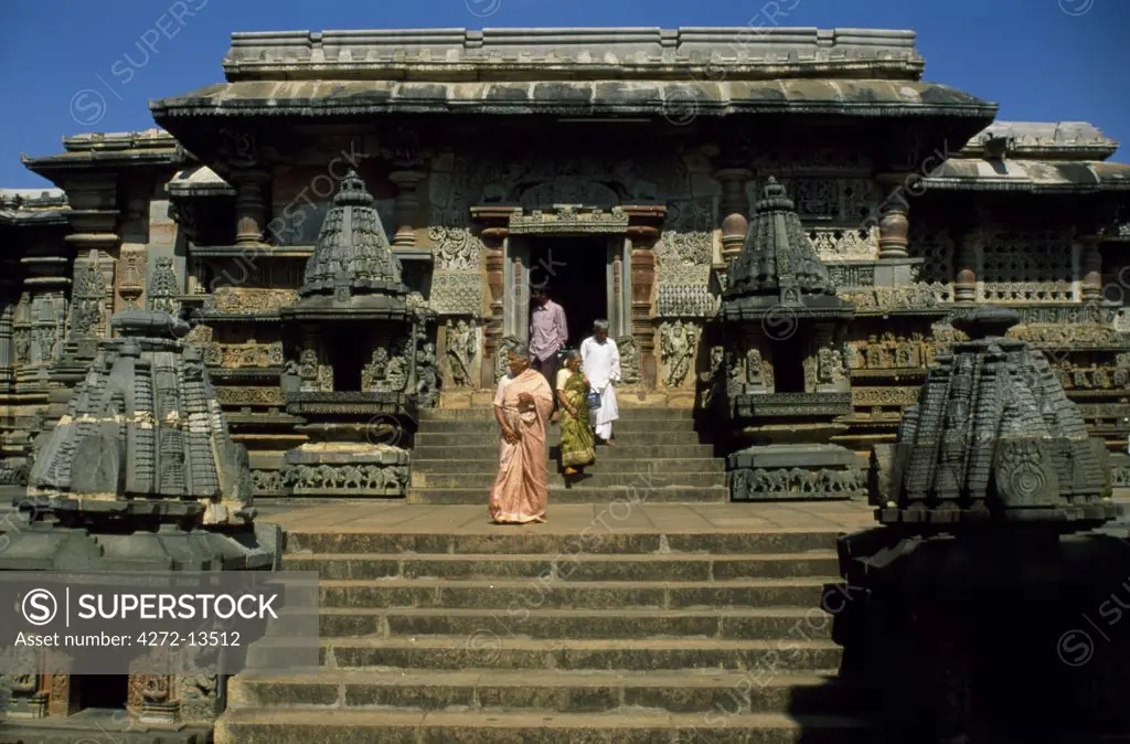 Hindu faithful emerge from the door of the 12th century Chennakeshava Temple, built by the ruling Hoysala dynasty, which boasts some of India's most celebrated sculpture
