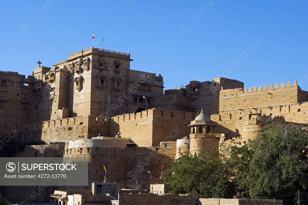 India, Rajasthan, Jaisalmer. Jaisalmer Fort - The ramparts and towers of the main 'living' fort built in 1156 by the Bhati Rajput ruler Jaisal. It is situated on Trikuta Hill and has been the site of many battles.