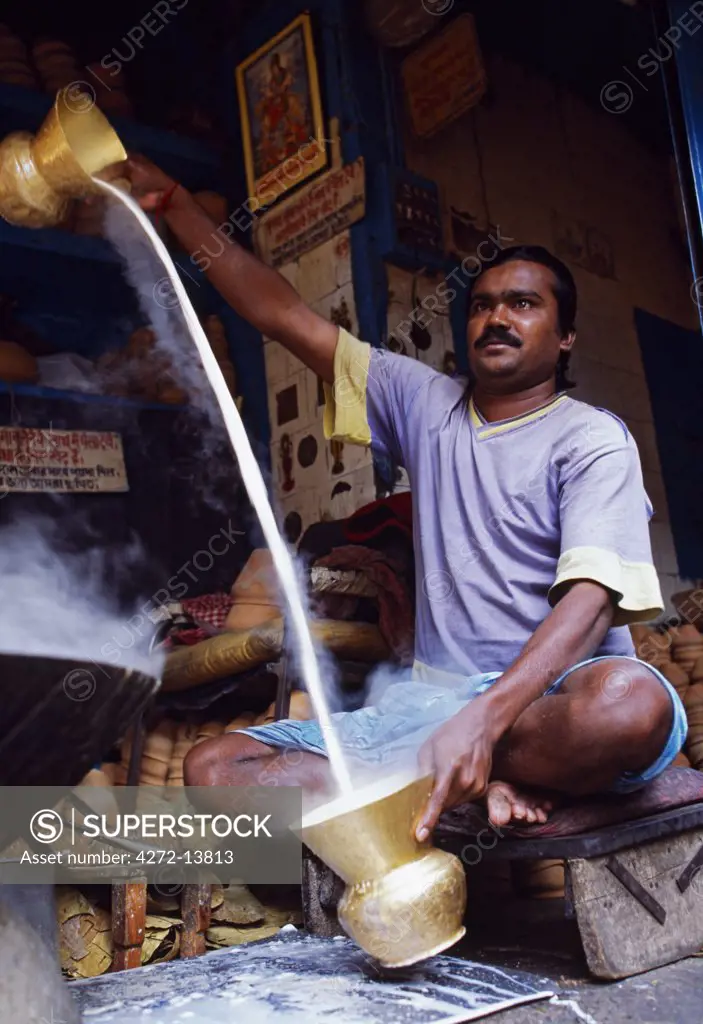 Preparing sweet milk in a stall on the streets of Barabazaar in North Kolkata.