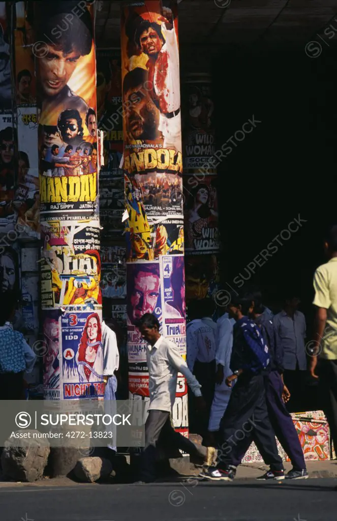 Bollywood posters pasted to pillars, Central Kolkata.