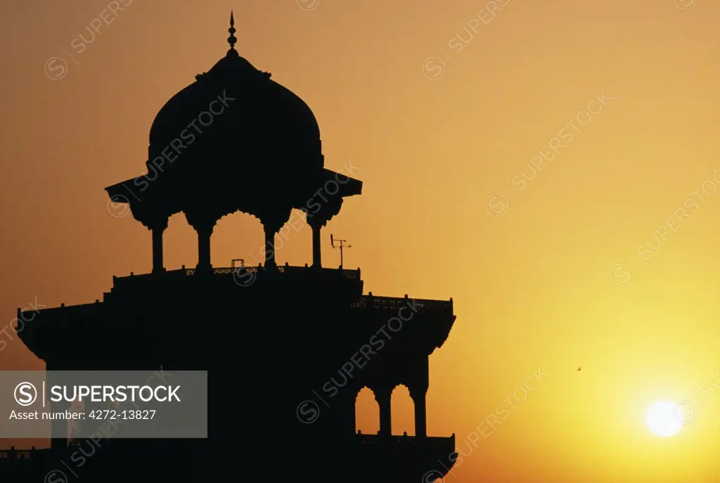 Towers of the Taj Mahal at sunset, Agra. Taj Mahal was built by a Muslim, Emperor Shah Jahan in the memory of his dear wife and queen Mumtaz Mahal. It is an elegy in marble or some say an expression of a dream. Taj Mahal, meaning Crown Palace, is a Mausoleum that houses the grave of queen Mumtaz Mahal at the lower chamber.