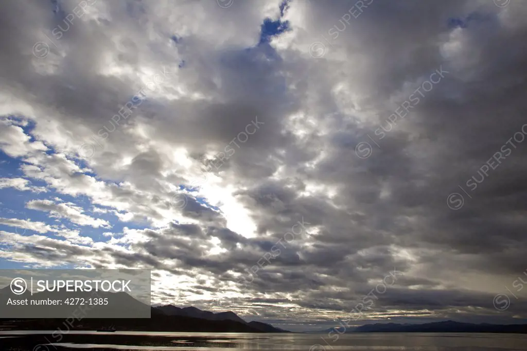 Argentina, Tierra del Fuego, Ushuaia, Beagle Channel. Late afternoon cloud and weather build up over the Beagle Channel viewed from the port of Ushuaia.