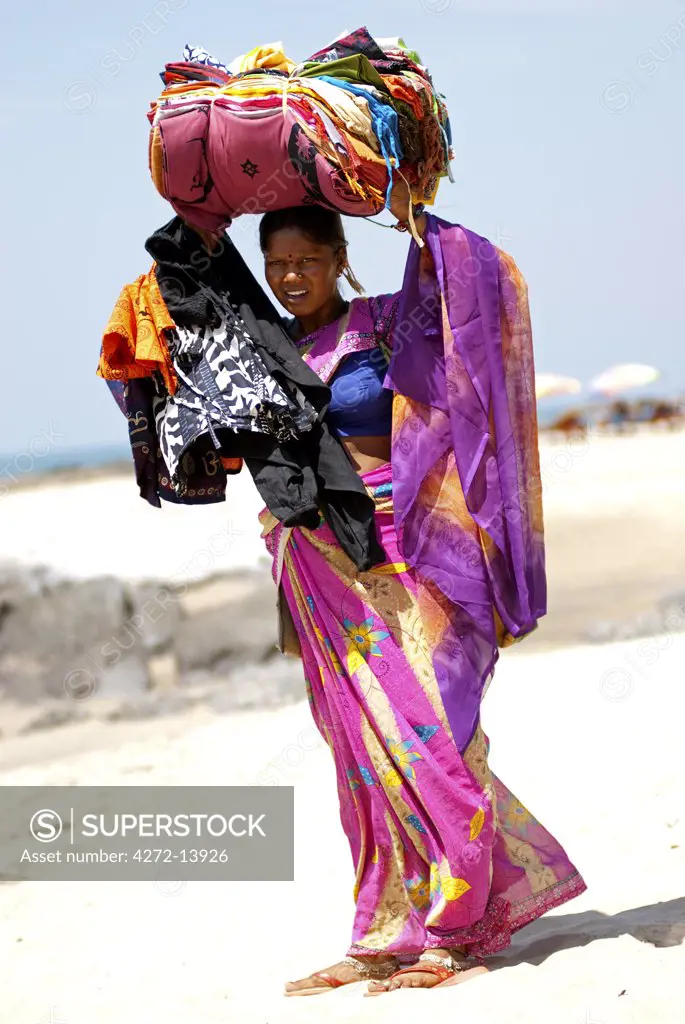 India; Goa. Woman trader on Vigator Beach.