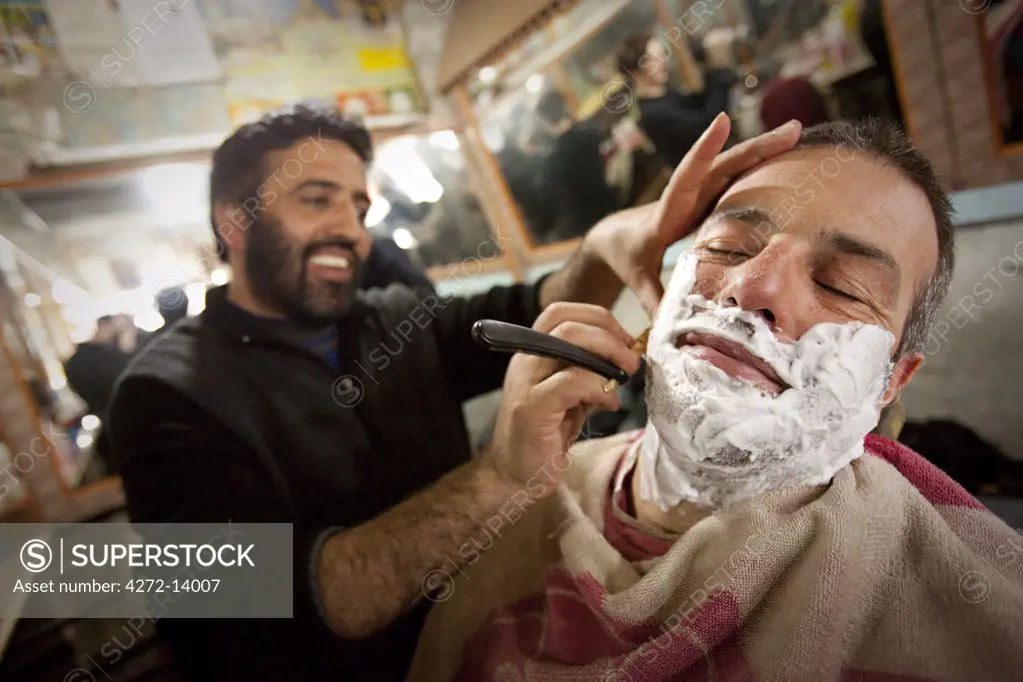 Having a shave at the local barber in Gulmarg, Kashmir, India