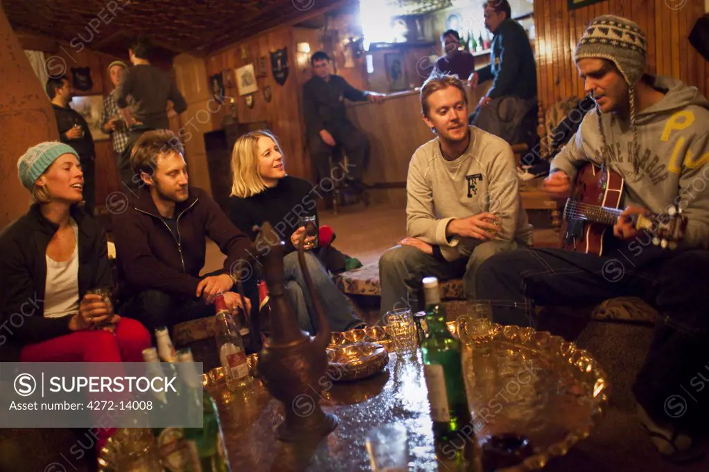Skiers enjoy a drink at the bar in the Highlands Park Hotel in Gulmarg, Kashmir, India
