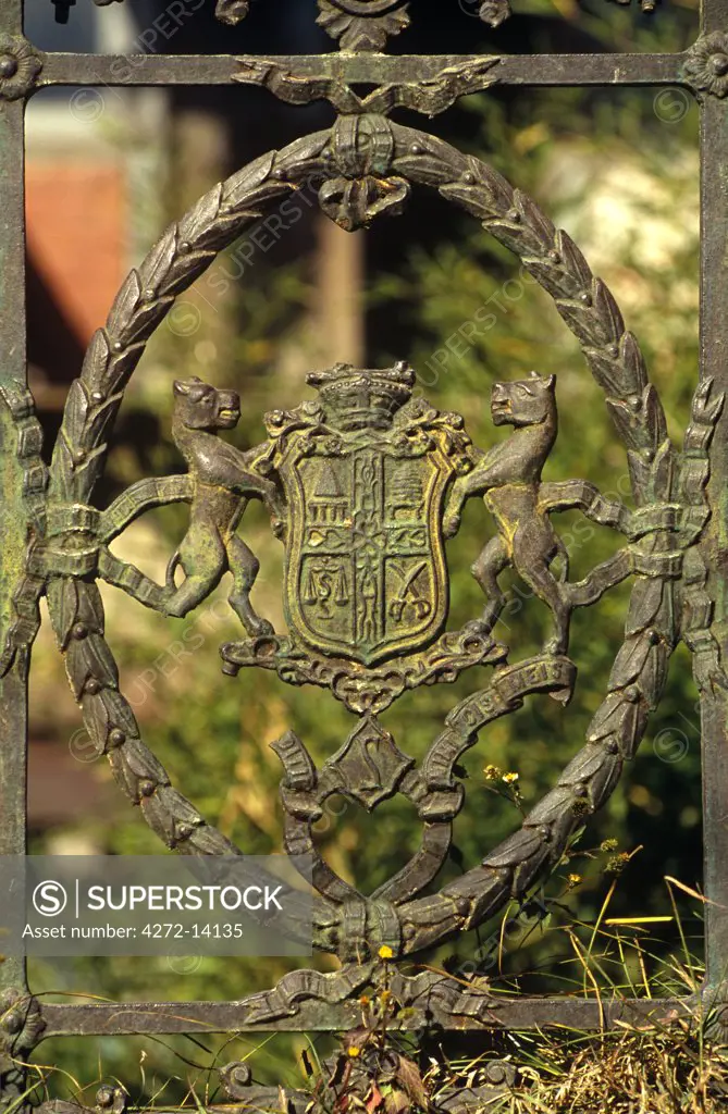 India, Himachal Pradesh, Shimla, aka Simla. This decorative ironwork edging a garden gate recalls the British presence in Sihimla.