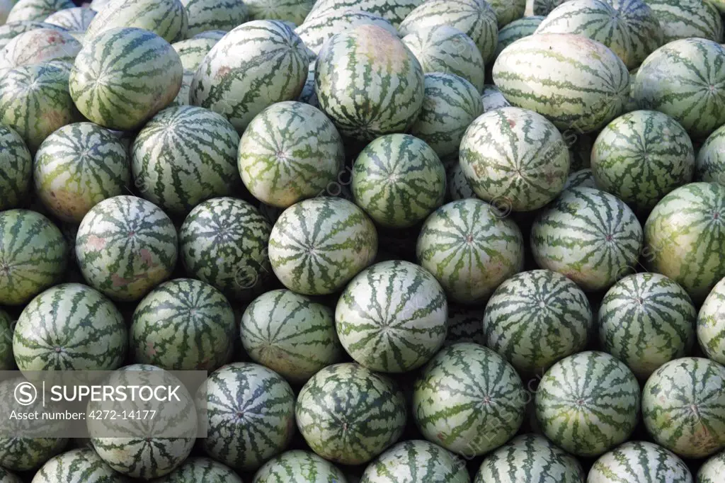 India, South India, Kerala. Watermelon stacked in a market in Cochin.