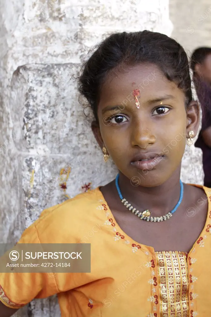 India, Tamil Nadu. Portrait of an Indian girl at the Minakshi Sundareshvara Temple.