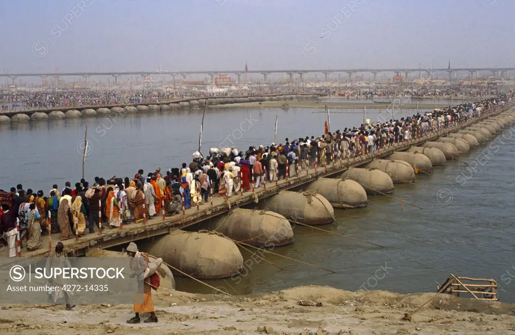 India, Uttar Pradesh, Allahabad. Temporary pontoon bridges across the River Ganges help ease the massive flow of Hindu pilgrims attending the celebrated Kumbh Mela festival held here every twelve years.