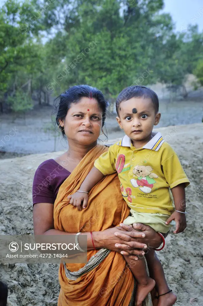 Woman and child in Dayapur. Sundarbans National Park, Tiger Reserve. West Bengal, India