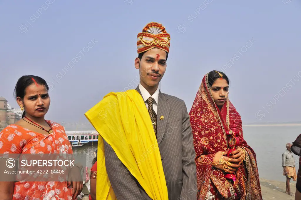 The grooms in a marriage on the banks of the Ganges river. Varanasi, India