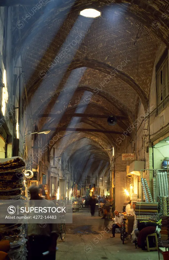 Iran, Esfahan. Rays of sunlight stream into the mainly 16th Century Bazar-e-esfahan sometimes known as the Great or Royal Bazaar in central Esfahan