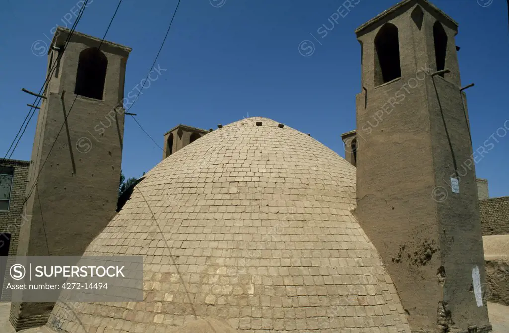 Iran, Yazd. Rooftop badgirs, or wind towers, are designed to cool homes; these stand at ground level and cool the water storage tank.  These are found in Yazd's old quarter.