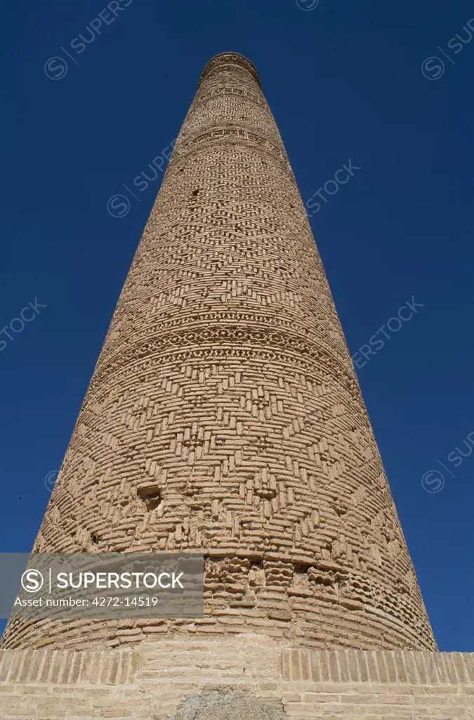 The Khosrogerd minaret, near Sabzevar, Iran. This minaret is one of Iran's finest and best preserved Seljuk era minarets which stands in an open field just west of the small town of Sabzevar.  Bereft of its balcony, it still reaches to almost 30 metres in height and is all that remains of the Silk Road town of Khosrogerd, obliterated by the Mongols in 1220.