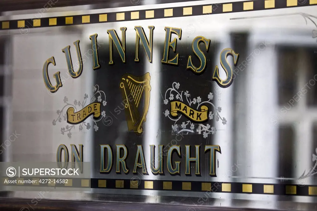 Ireland, Dublin, Portobello, Guinness Draught sign on the doors of the Bleeding Horse pub.