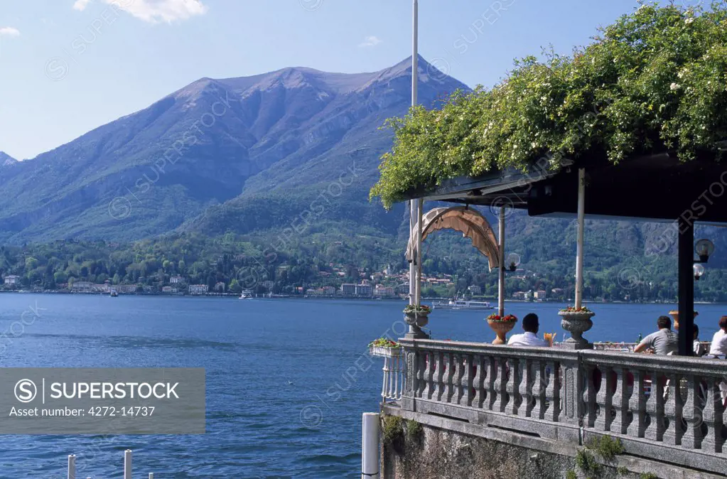 Terrace of the Grand Hotel Villa Serbelloni in Bellagio with view across the lake with ferries.