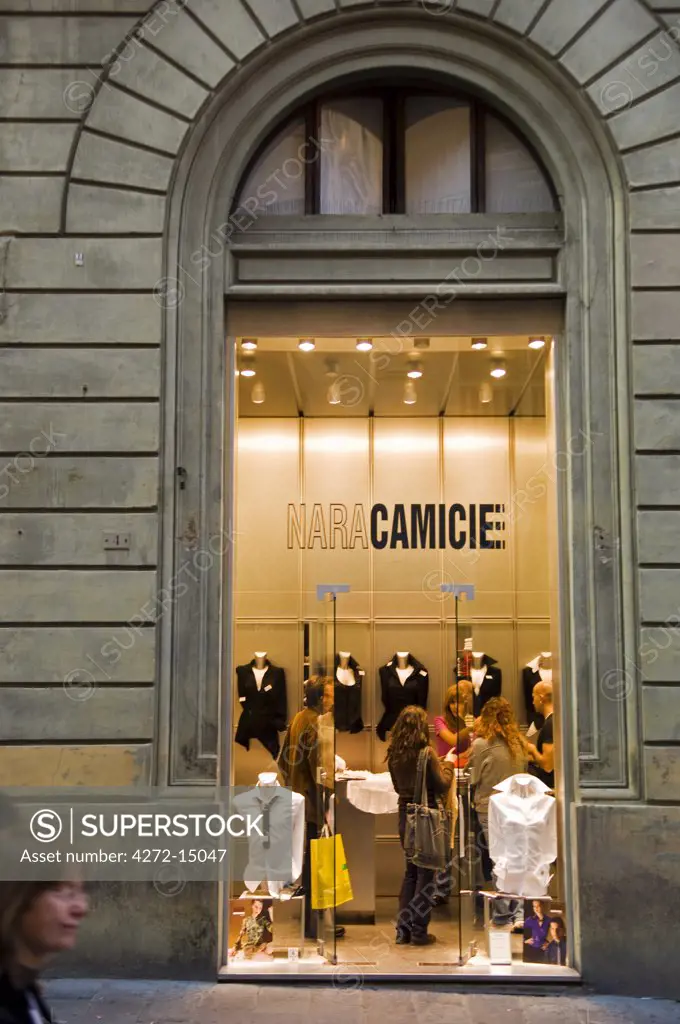 Italy, Tuscany, Siena. Clothing displayed in the window of one of Siena's elegant boutiques