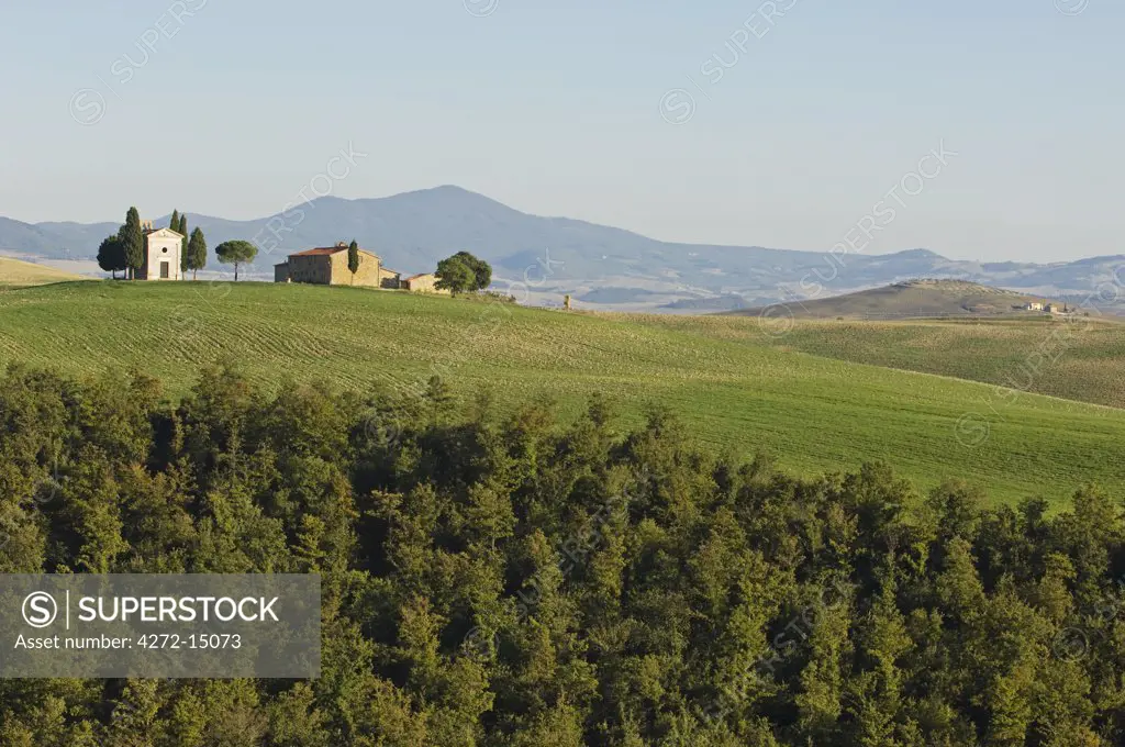 Italy, Tuscany, Val d'Orcia. Chapel of Vitaleta and farmhouse.
