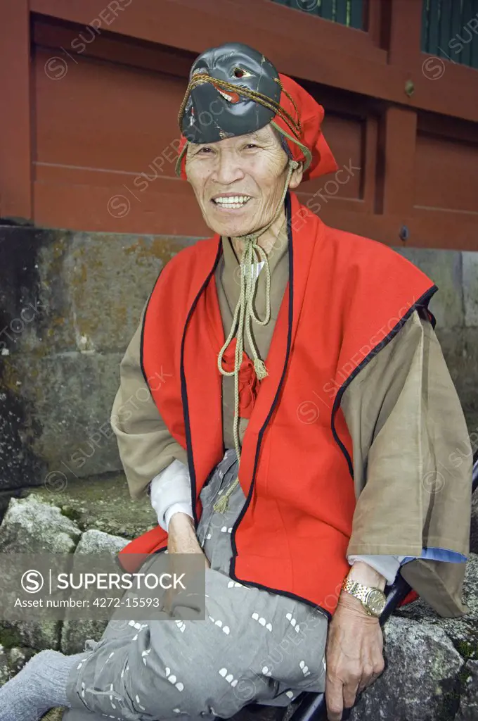 Spring Festival Toshogu shrine Tokugawa dynasty old man wearing traditional parade costume and mask
