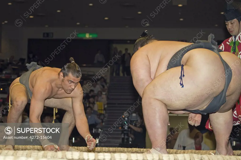 Grand Taikai Sumo Wrestling Tournament small western wrestler and huge Japanese opponent.