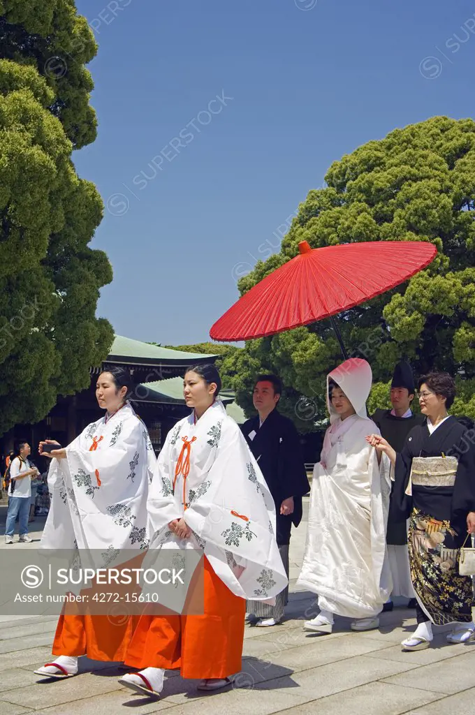 Meiji jingu Shrine 20th Century priest bride groom and family at traditional Japanese wedding