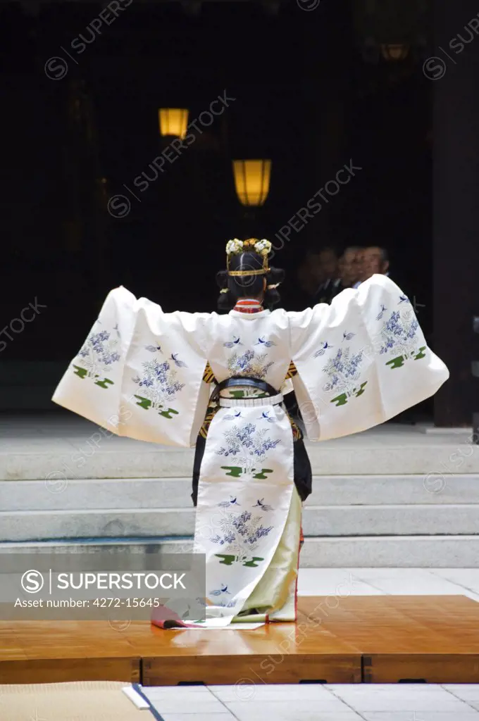 Japan, Honshu Island, Tokyo, Harajuku District. Meiji Shrine - dedicated to Emperor Meiji in 1920 - dance by Shrine Maidens in special Kimonos for Culture Day Holiday.