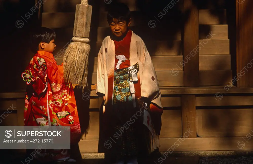 Japan, Honshu Island, Kyoto. Visiting Yasaka Shrine during the festival of Shichi go san. November 15 is the official date of Shichi go san, a day of prayer for the health of young children.