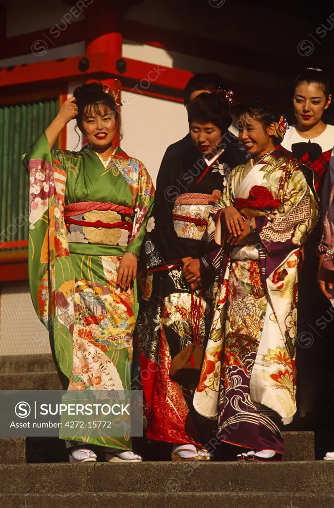Japan, Honshu Island, Kyoto. Women in traditional Kimonos visiting Yasaka Shrine.