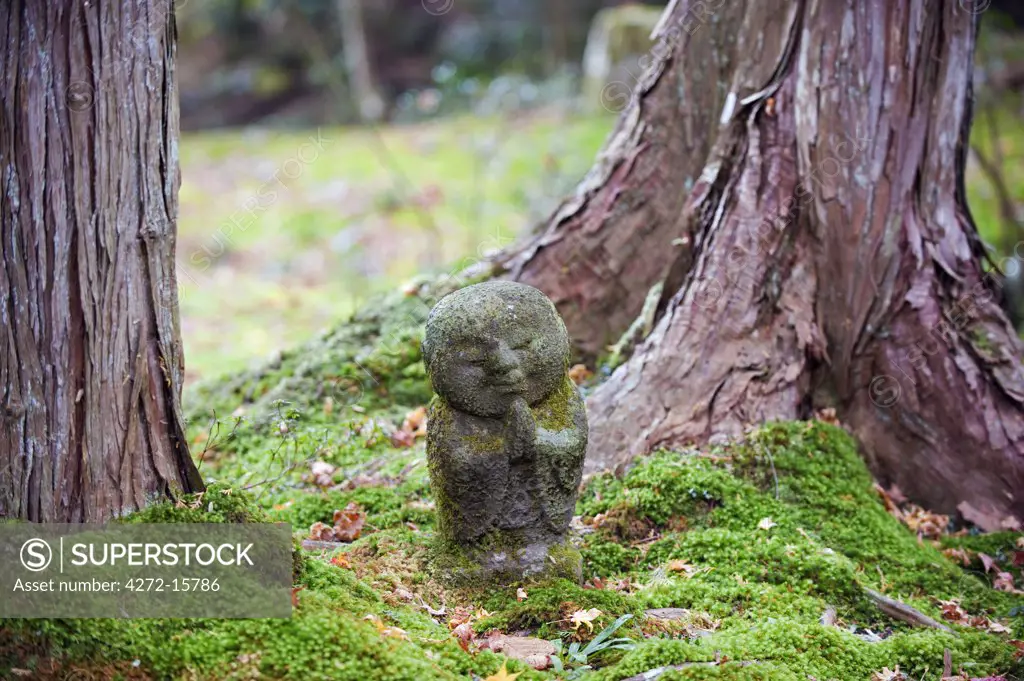 Asia, Japan. Kyoto, Sanzen in temple (986), stone statue of a monk praying