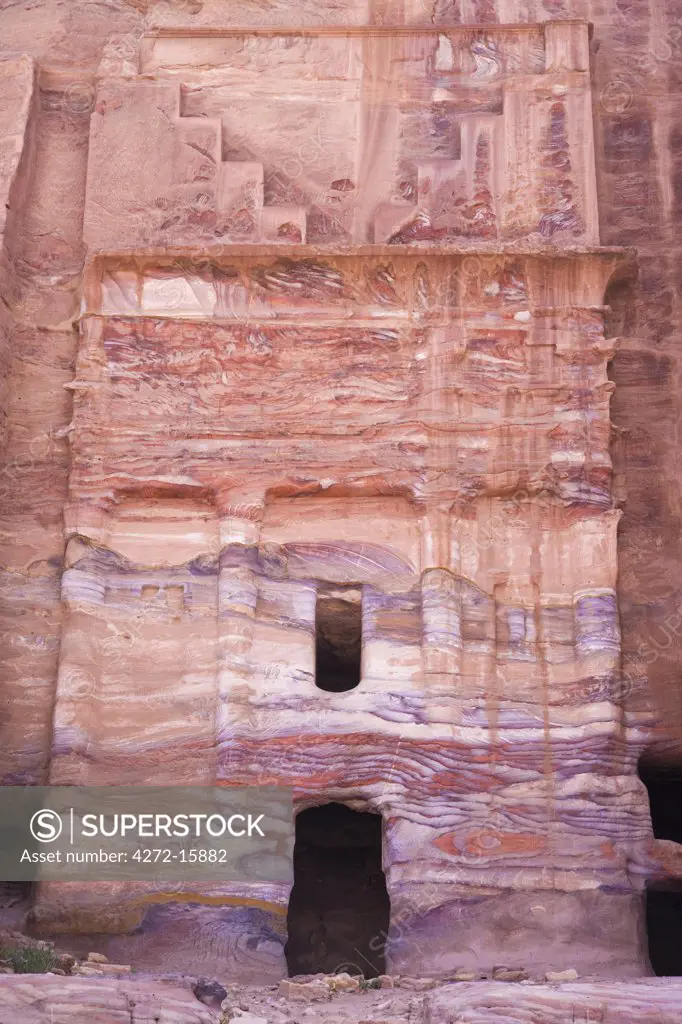 The weathered facade of the Silk Tomb, one of the Royal Tombs at Petra, Jordan