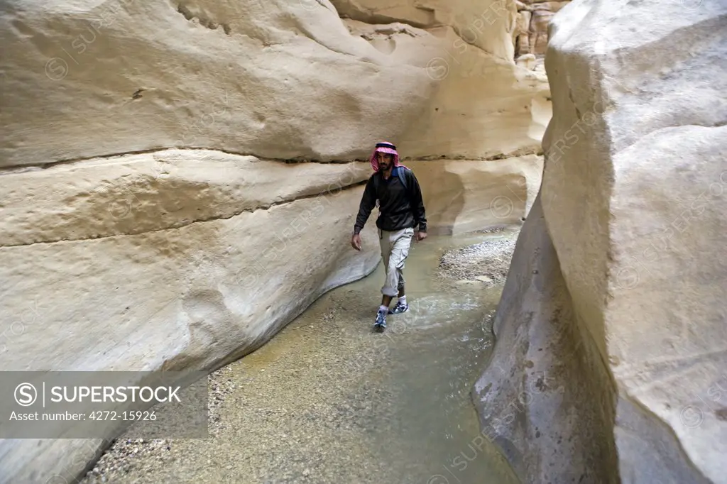 Jordan, Petra Region. Exploring Wadi Daphna which links the highland area of Mansura with the ancient trading center of Finan. (MR)