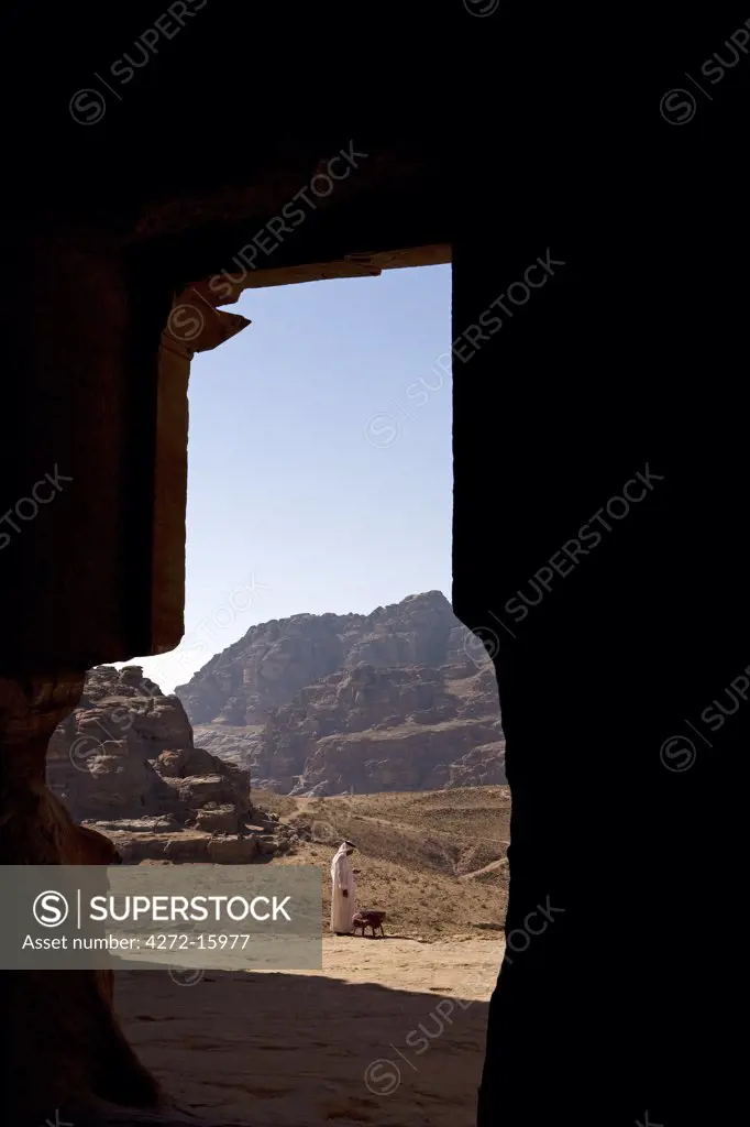 Jordan, Petra.   Looking out from the Urn Tomb part of a complex of Royal Tombs set into the rock-face of the Jabal Al-Khubtha, towards the summit of Al-Habees.