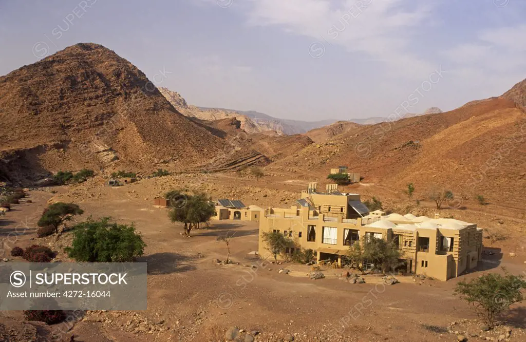 Jordan, Dana Biosphere Reserve, Wadi Feynan. The remote Feynan Eco-lodge stands amidst desert scenery near the confluence of Wadi Feynan and Wadi Araba.
