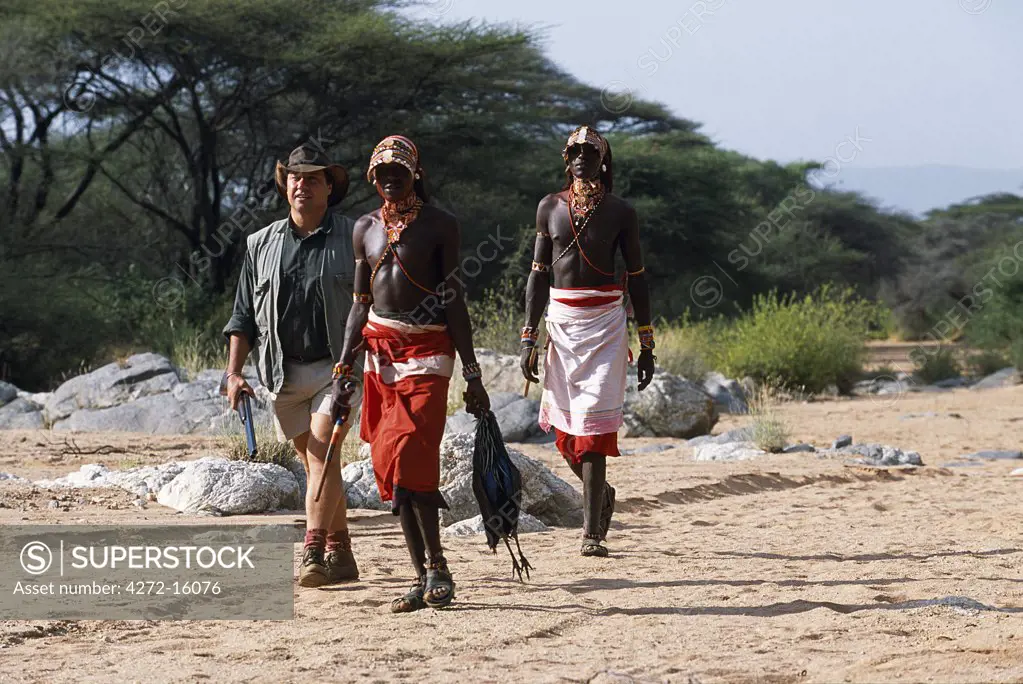 Samburu morani (warriors) drive and pick up birds on a  bird shooting safari.
