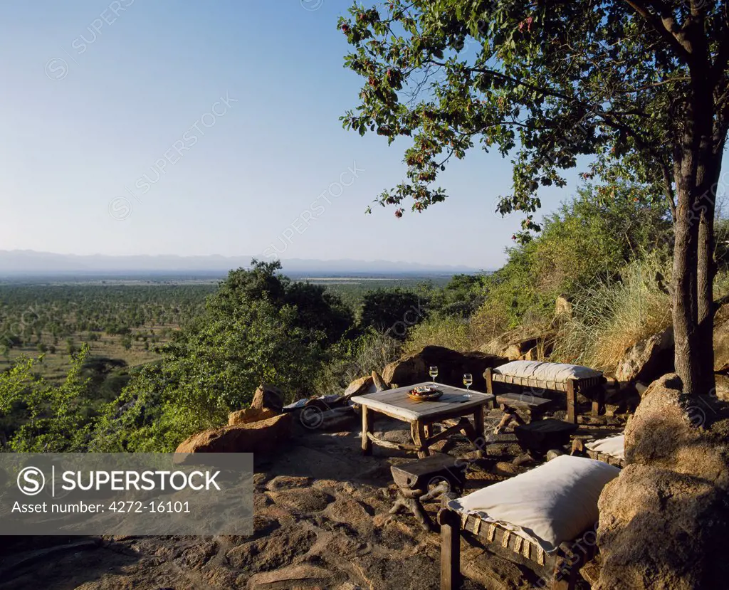 Sundowners at the Rock Bar at Elsa's Kopje, with panoramic views across Meru to the Nyambeni Hills.
