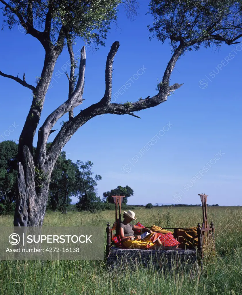 Bush style, relaxing in a Lamu bed at Cheli & Peacock's Mara Camp.(MR)