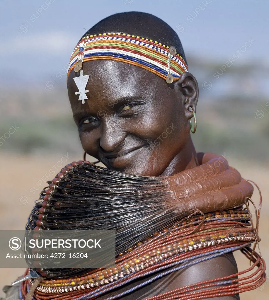 A Samburu woman wearing a mporro necklace, which denotes her married status.  These necklaces were once made of hair from giraffe tails but nowadays, the fibres of doum palm fronds are used instead.