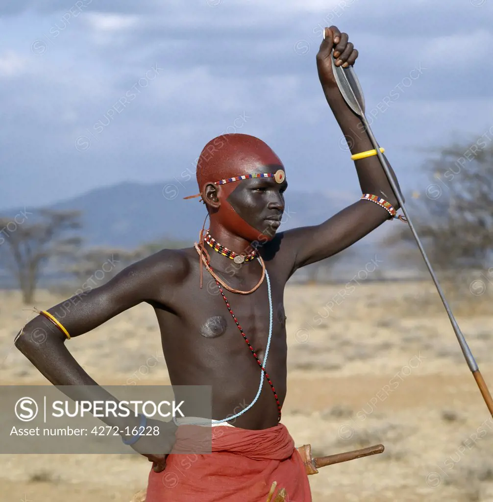 A month after a Samburu youth has been circumcised, he becomes a warrior. He will go to the nearest stream or Waterhole to wash off a months grime. He then decorates himself with a mixture of ochre and animal fat, and adorns himself with beads. The scarring round this mans nipples is a sign of beauty.